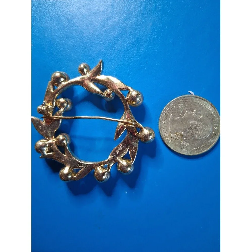 Vintage Monet Wreath Brooch With Gold Tone leaves & rounded bead-like elements